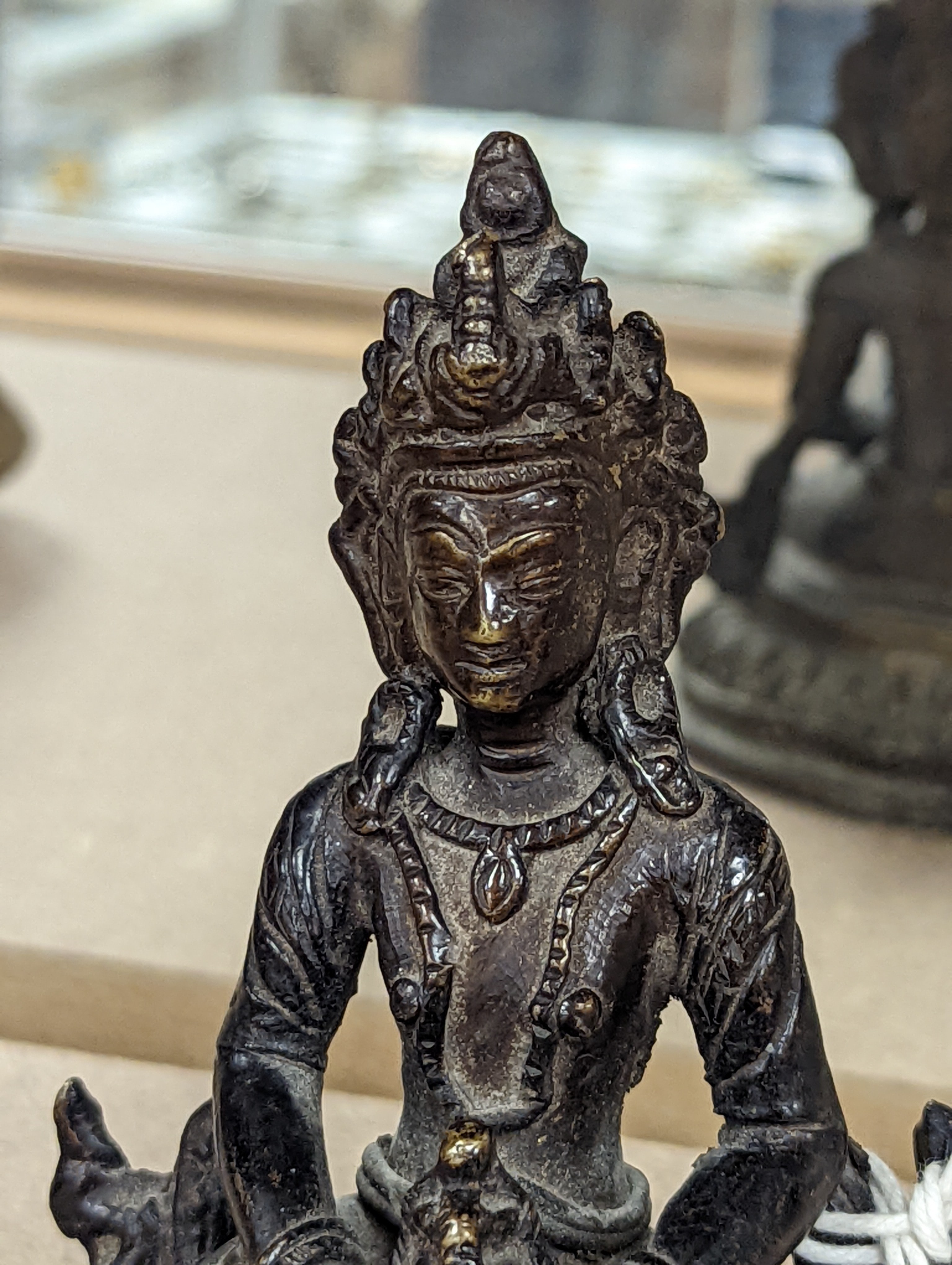 A 19th/20th century Himalayan bronze buddha 12cm